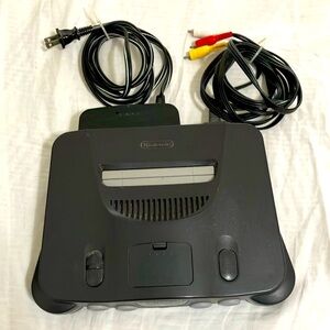 Nintendo 64 console with power cord and AV cords.